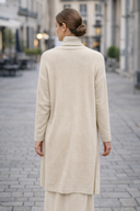 Back view of woman wearing cream 3 Piece Sweater Skirt Set on a street