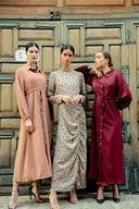 Three women modeling beige button down drawstring maxi dress