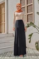 Woman in hijab wearing black satin maxi skirt