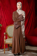 Woman in brown lace-sleeve front zipper abaya dress