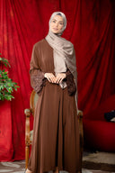Woman in brown abaya hijab wearing coffee lace sleeve front zipper dress