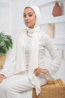 Woman wearing a White Jersey Hijab with Undercap, lightweight and drapable, perfect for effortless styling, suitable for all-day wear.