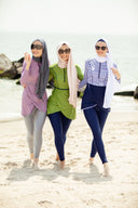 Three women modeling lime green 3-piece modest burkini swimsuit